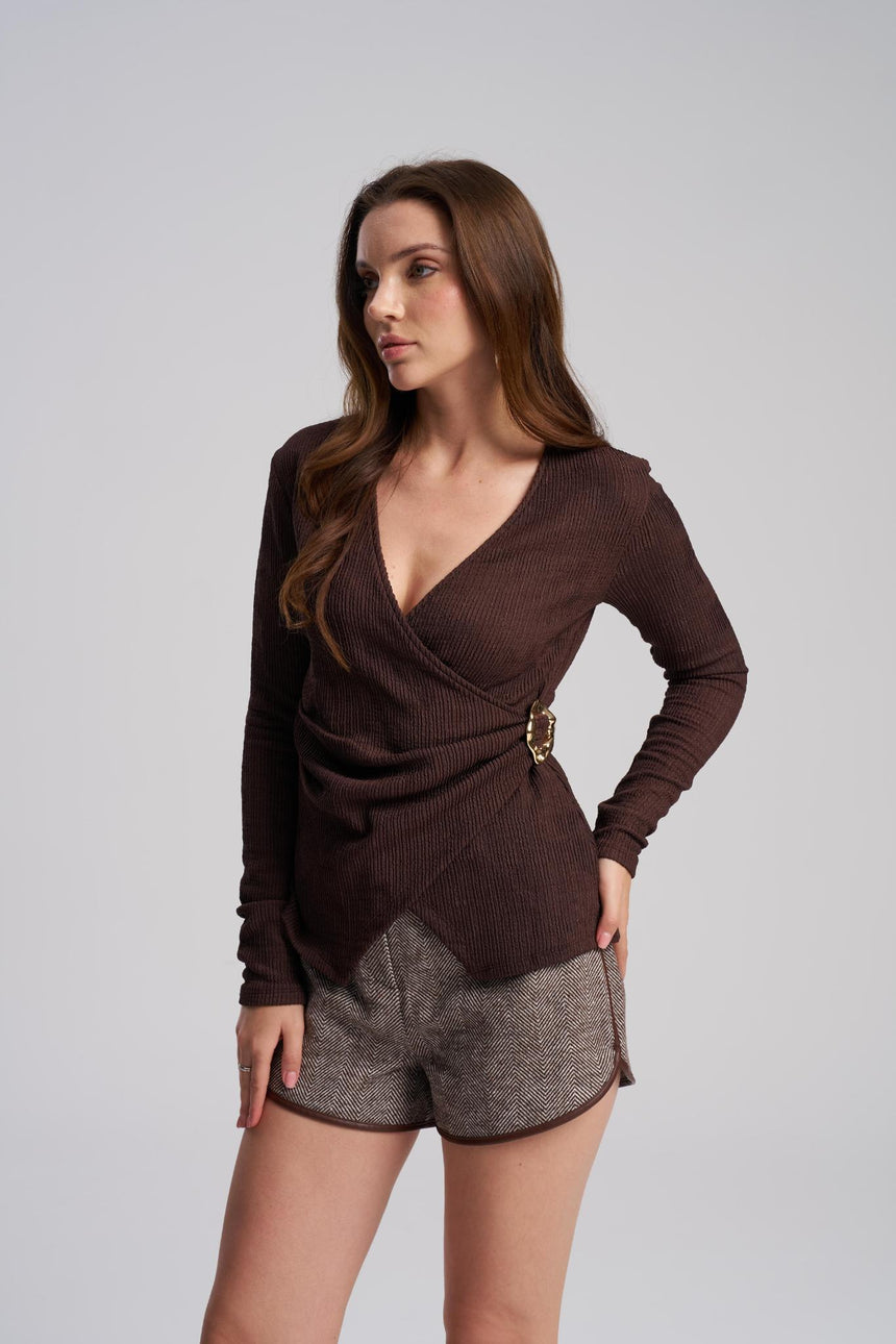 Stretch fitted evening top with gold accessory