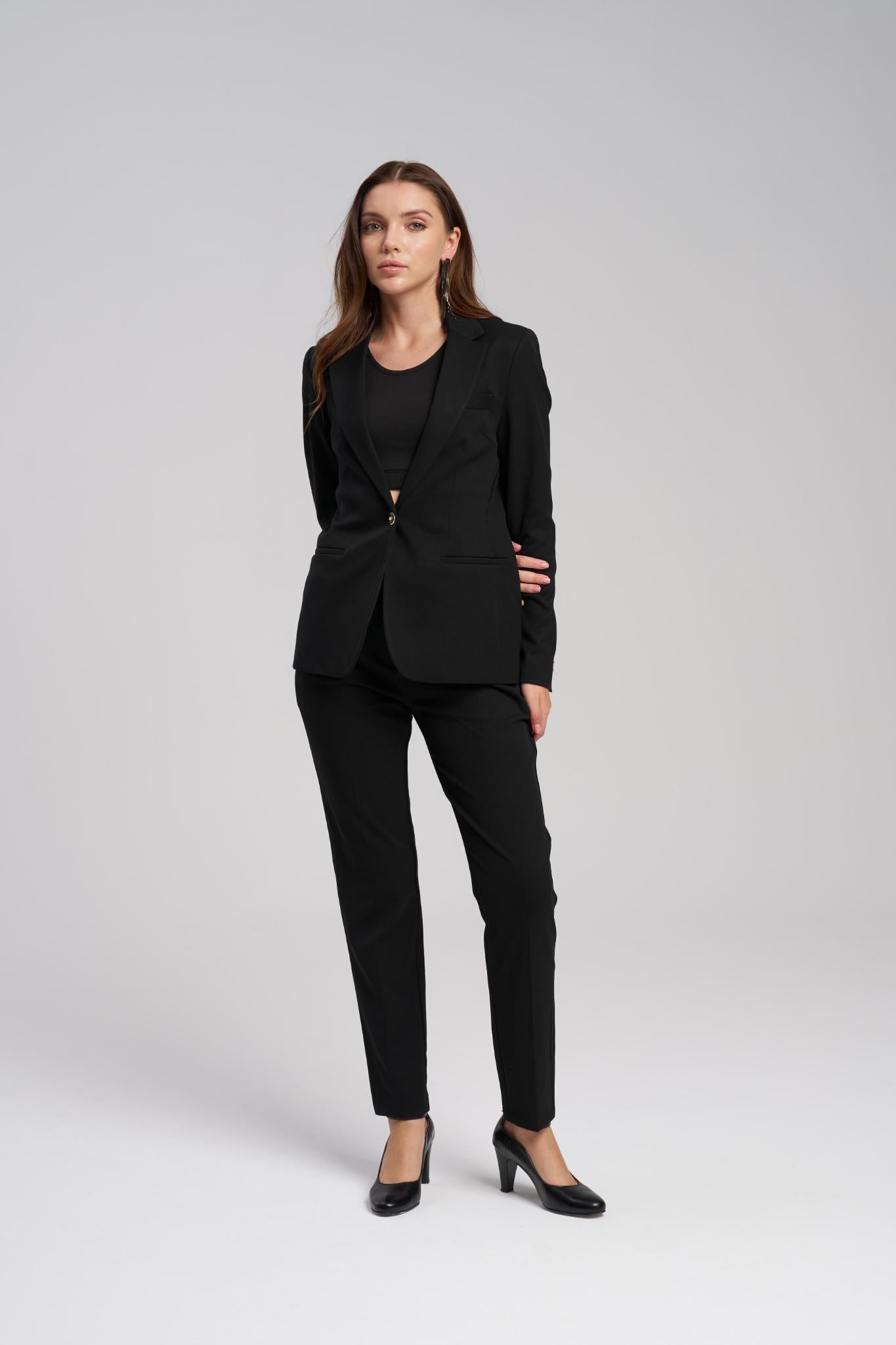 Woman wearing a black suit on a white background