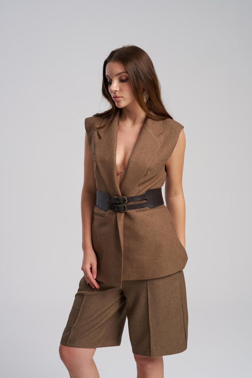 Close up detail of waist belt on tailored vest set