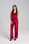 Woman wearing a red velvet set on a white background